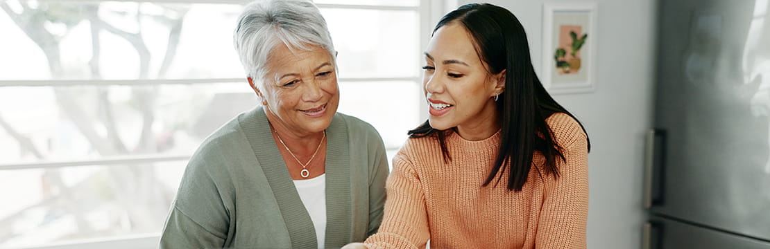 Smiling mother and daughter